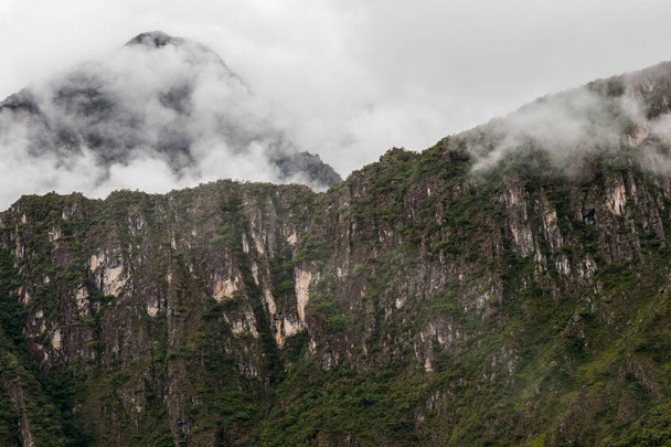 Rocky mountains and fog near Machu Picchu. - Fotoğraf, Görsel