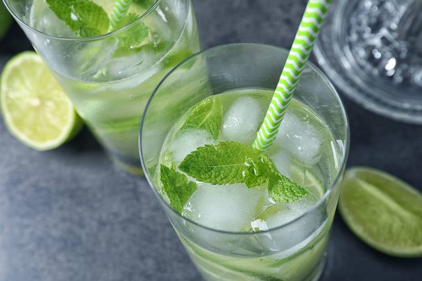 Glasses of natural lemonade with lime on table, closeup - Фото, зображення