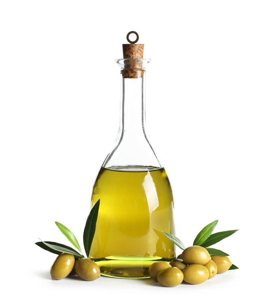 Glass bottle with fresh olive oil on white background - Foto, Imagem