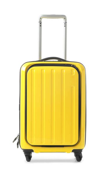 Bright yellow suitcase packed for journey on white background - Fotoğraf, Görsel