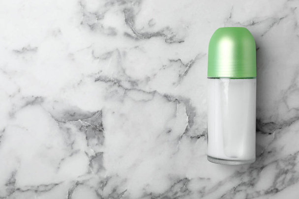 Deodorant on marble background, top view. Skin care - Фото, зображення