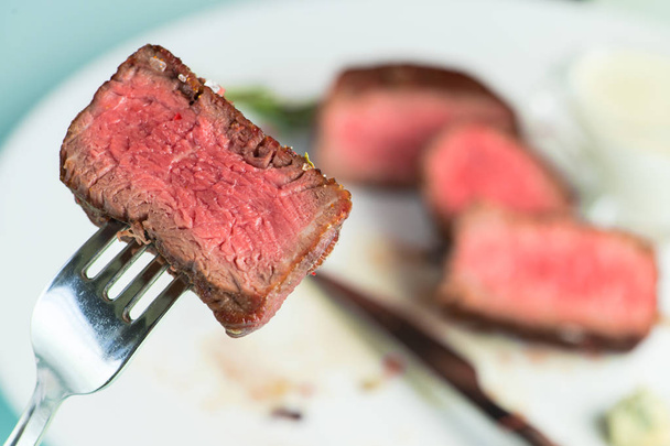 beef steak impaled on fork - Φωτογραφία, εικόνα
