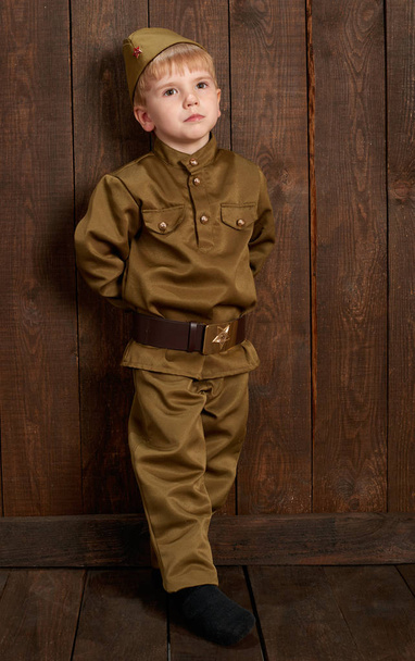 children are dressed as soldier in retro military uniforms - Фото, изображение