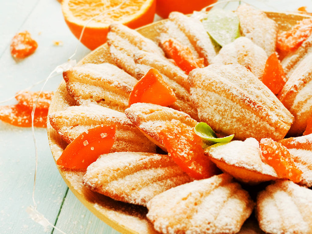 French cookies Madeleines with dried oranges. Shallow dof. - Photo, Image