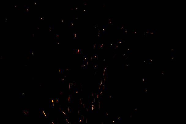 Étincelles et feu sur fond noir - Photo, image