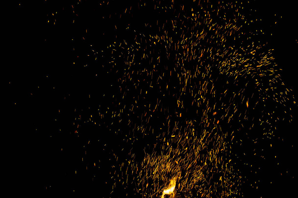 Sparks and fire on a black background - Photo, Image