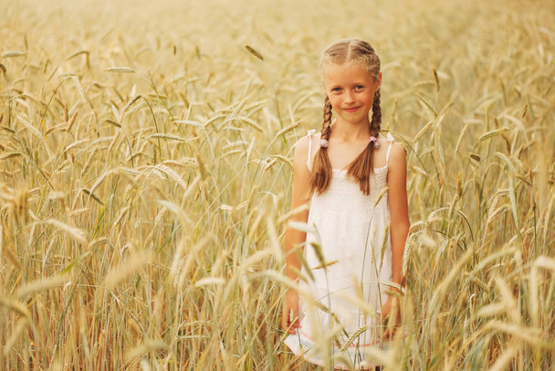 young girl in the yellow field - Фото, зображення