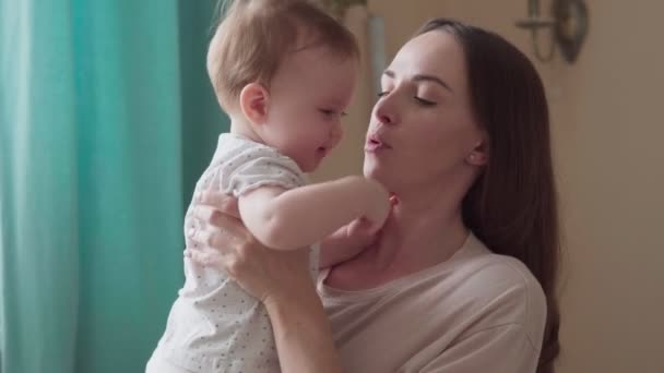 Caring mother calms her little crying child - Materiał filmowy, wideo
