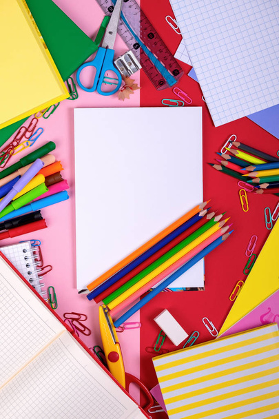 School supplies on blackboard background with copy space. Top view - Photo, Image