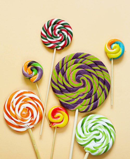 colorful lolly pop candy on a pastel background - Fotó, kép