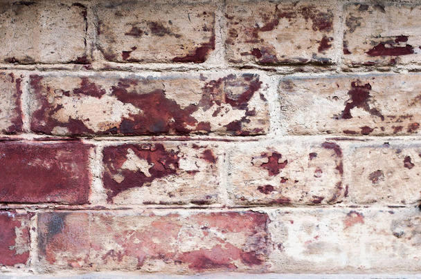 Background of old vintage dirty brick wall with peeling plaster, texture - Photo, Image