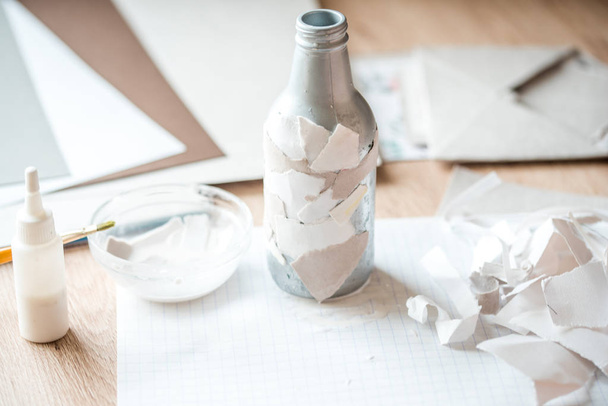 Recycling of garbage. handmade paper, gray bottle. - Foto, afbeelding