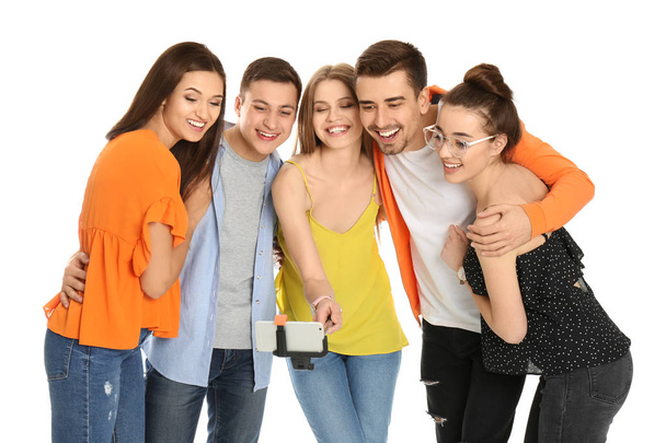 Young happy friends taking selfie against white background - Foto, Imagen