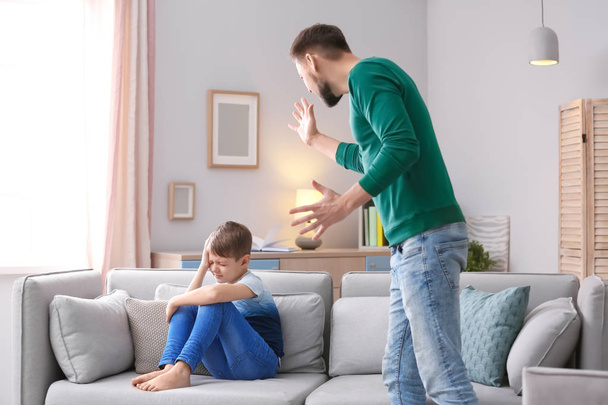 Father arguing with son at home - Photo, image