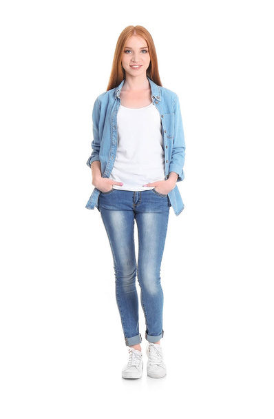 Young woman in stylish jeans on white background - Foto, Imagem