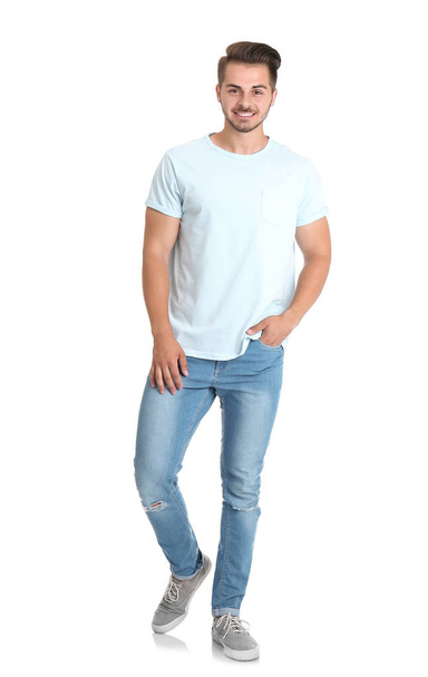 Young man in stylish jeans on white background - Foto, immagini