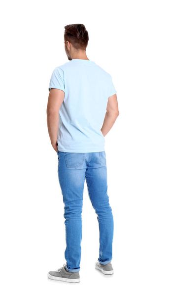 Young man in stylish jeans on white background - Foto, Bild