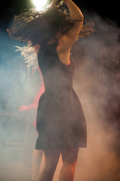 portrait of attractive girl dancing in night club  - Zdjęcie, obraz