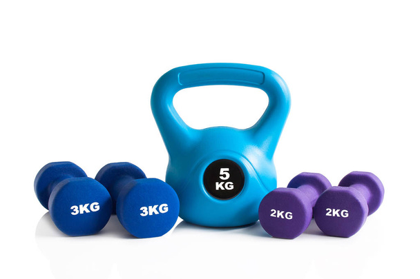 Kettlebell and dumbbells for fitness training isolated on a white background. - Photo, Image