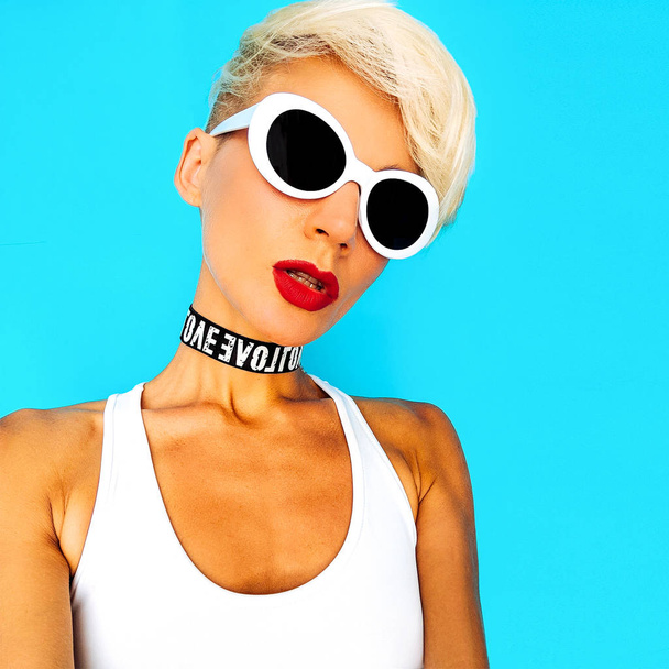 Sexy Tomboy Girl in fashion accessories sunglasses and chokers - Foto, imagen