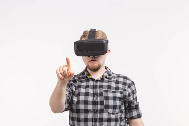 Man wearing virtual reality goggles on white background - Photo, Image