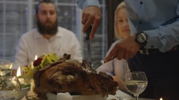 Man carving turkey on holiday dinner - Footage, Video