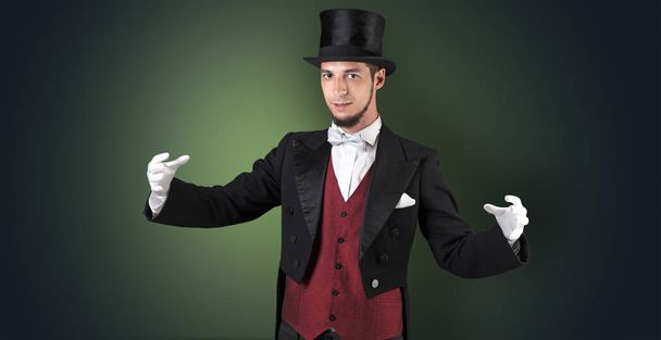 Magician holds something invisible  - Zdjęcie, obraz
