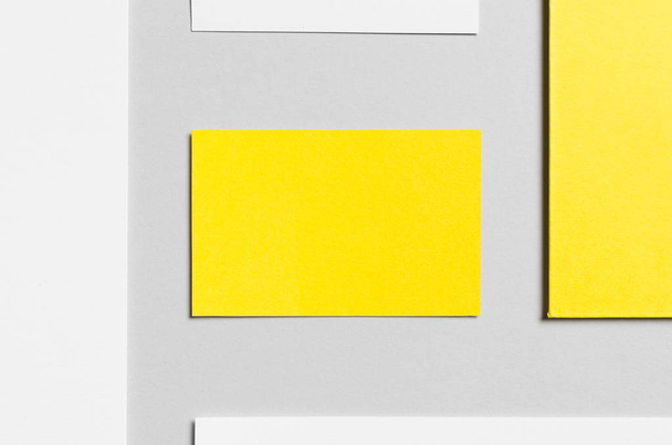 Branding / Stationery Mock-Up - Yellow & White. Close-Up - Letterhead (A4), DL Envelope, Compliments Slip (99x210mm), Business Cards (85x55mm) - Photo, Image