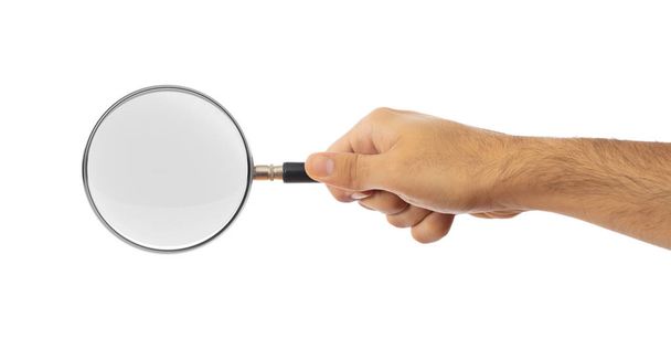 Search concept. Magnifying glass on a male hand palm isolated on white background, clipping path - Photo, Image