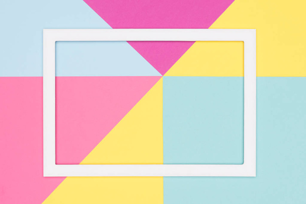 Abstract geometry flat lay pastel blue, pink and yellow paper texture minimalism background. Minimal geometric shapes and lines template with empty picture frame mock up. - Fotografie, Obrázek