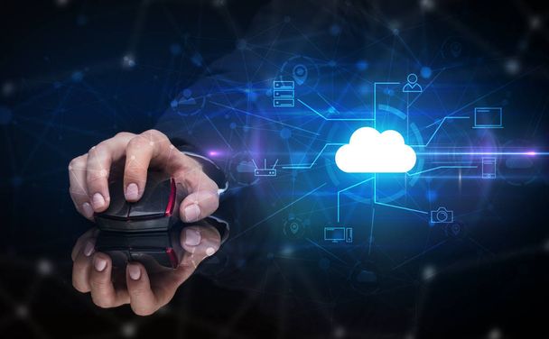 Hand using mouse with cloud technology and online storage concept - 写真・画像