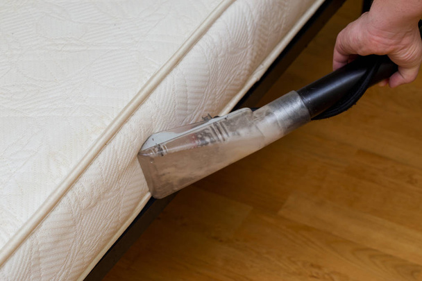 dry cleaning of an old white mattress - Fotó, kép