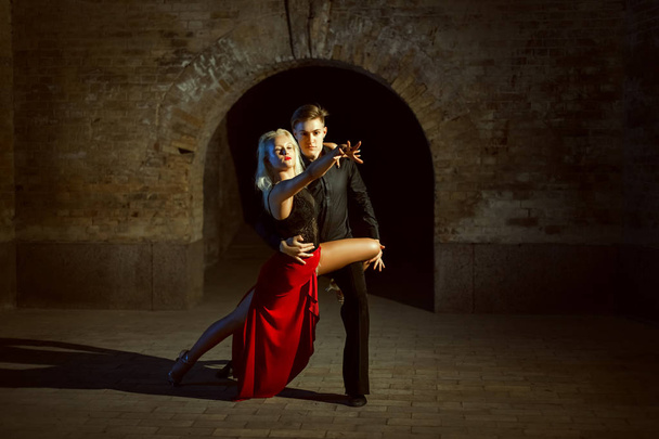 Portrait of a beautiful young couple. They dance tango. - Photo, Image