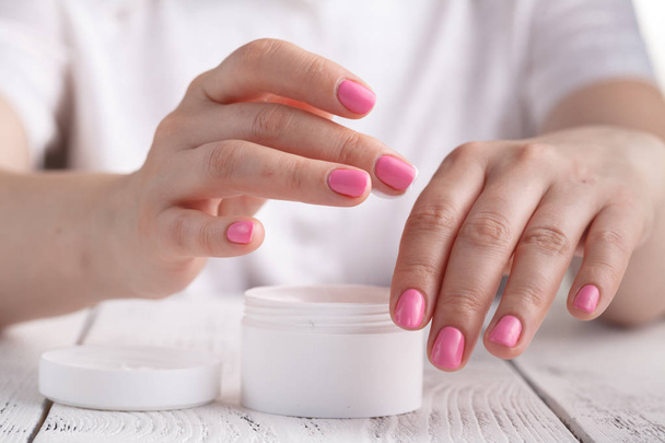 Woman applying hand cream - 写真・画像