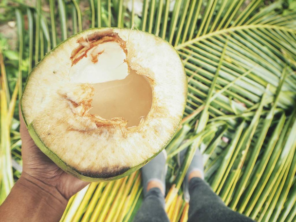 Selfie of coconut drink on hand - Photo, Image