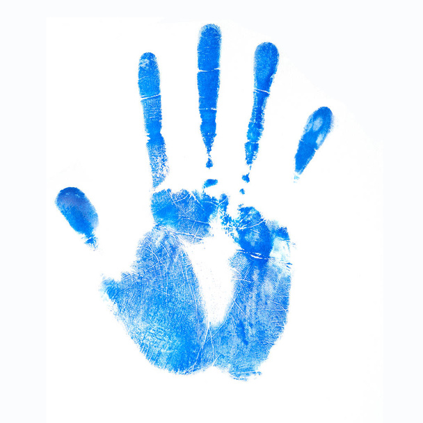 Ink blue human handprint. Palm on a white background in technology concept. No effects used. - Фото, зображення