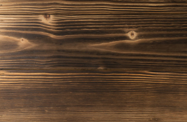 Oude donkere verbrand hout achtergrond. Scorched houten plank plank textuur. Natuurlijke rustieke foto achtergrond voor vintage hipster ontwerp - Foto, afbeelding