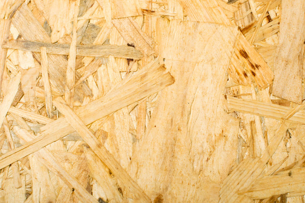 Chipboard background top view. Light brown osb panel texture or pressed and glued wood chips backdrop - Photo, Image