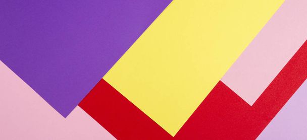 Color papers geometry flat composition background with violet, purple, pink, red, yellow tones. - Photo, Image