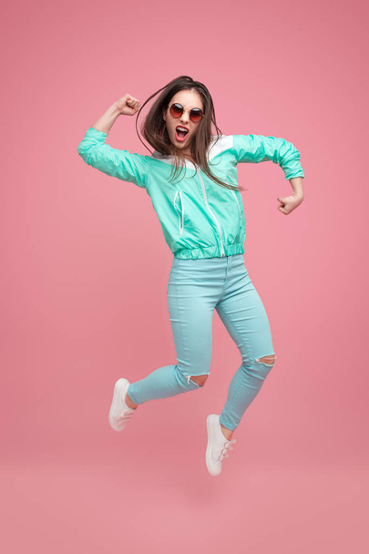Expressive hipster woman jumping up - Foto, imagen