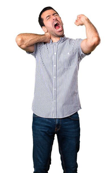 Handsome man yawning on isolated white background - Фото, изображение