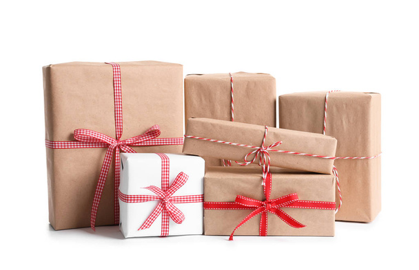 Beautifully wrapped gift boxes on white background - Fotoğraf, Görsel