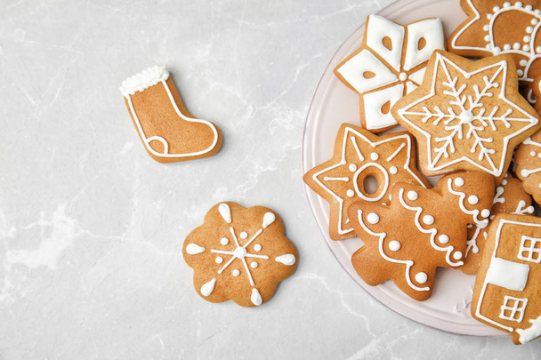 Plate with tasty homemade Christmas cookies on table, top view - 写真・画像