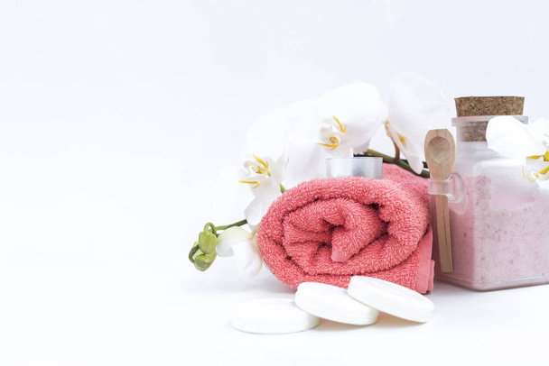 Spa accessories: soap, candle, towel, salt and orchid on white background. Spa salon and theraphy. - Photo, Image