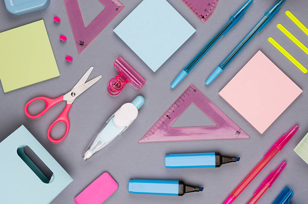 Back to school background - colored different stationery on grey table background, top view, pattern. - Fotoğraf, Görsel