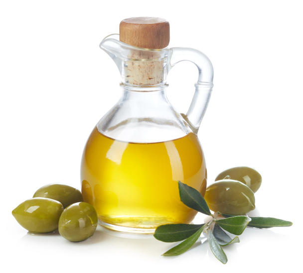 Bottle of fresh extra virgin olive oil and green olives with leaves isolated on white background - Foto, afbeelding