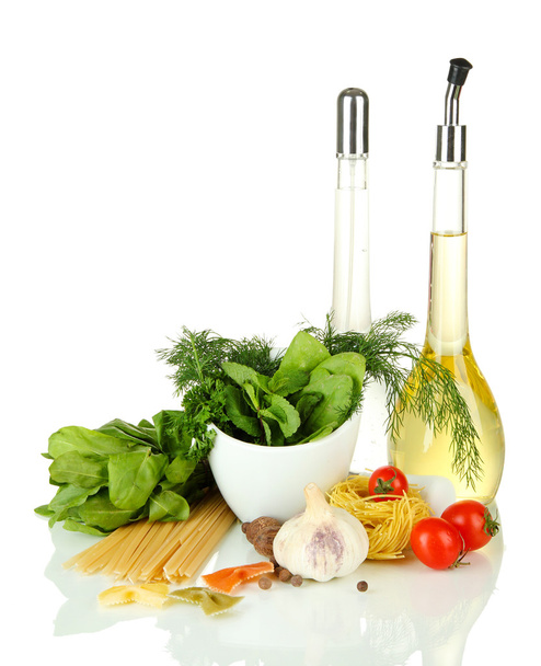 Composition of mortar, pasta and green herbals, isolated on white - Valokuva, kuva