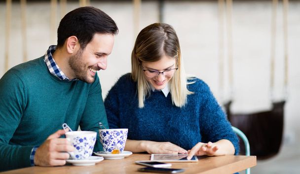 Young attractive couple on date together in coffee shop - Foto, immagini