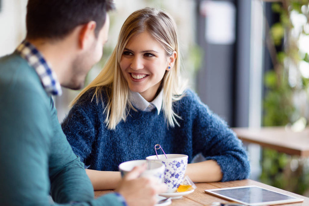 Young attractive couple on date together in coffee shop - Foto, Bild