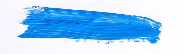 Blue brush stroke isolated over white background - Foto, imagen